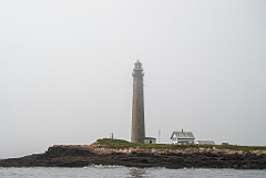Petit Manan Lighthouse on a Foggy Rocky Island in Maine